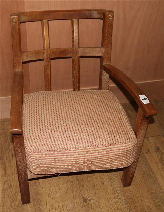 A William Morris style oak lattice back elbow chair